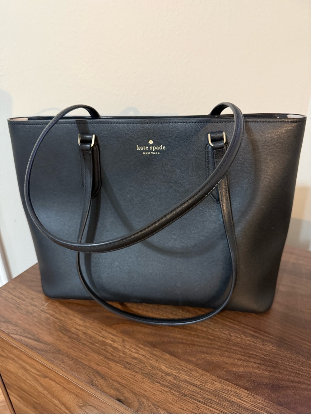 kate spade black leather tote with gold logo